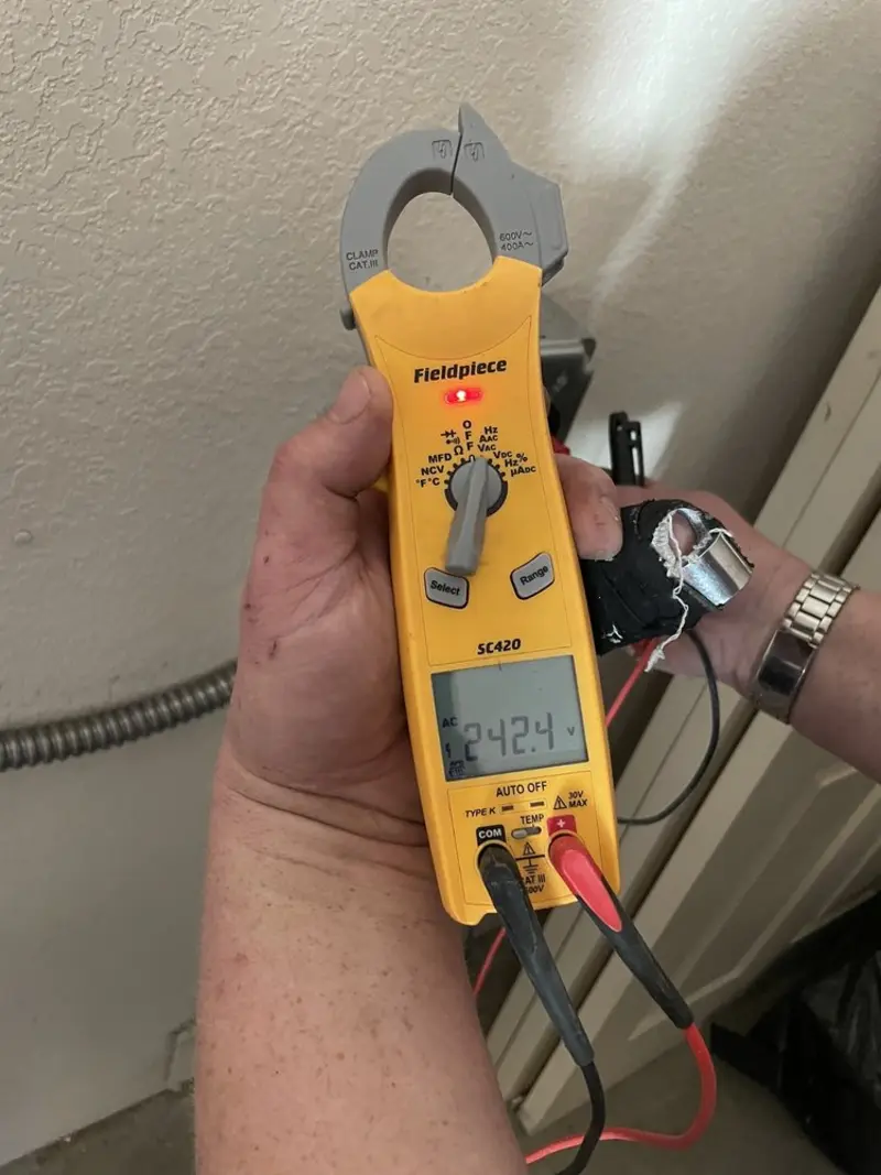 Voltage testing with clamp meter during Generator Installation in Lake Ridge